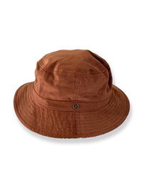 A brown bucket hat made of cotton corduroy with a button detail on the crown.