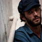 Model wearing The Twist Paperboy Cap – Blue Jean by FallenBROKENstreet. Denim baker boy hat styled with relaxed modern fit and timeless charm.