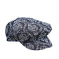 The Twist Paperboy Cap – Navy Tapestry by FallenBROKENstreet. Cotton-rich indigo denim baker boy cap with curved peak and satin lining. Unisex design with metal button details.