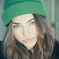Green Wally Beanie, breathable acrylic knit hat with cosy pull-on design.