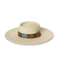 The Wanderer Cream woven straw hat with embossed leather band and metal button detail
