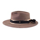 Side profile view of The Zephyr hat in warm brown felt, displayed on a white background. This angle captures the black and cream frayed cotton band with patina-finished pin. A softly aged, hand-shaped wool design perfect for travel, festivals, or daily wear. Adjustable inner band ensures the right fit. Built for durability, adventure, and sun-smart protection.

