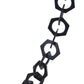 Macro detail of the SUPERNATURAL Chain in matte black acetate from Fallenbrokenstreet. Features oversized hexagonal links, a bold minimalist look, and premium quality materials for stylish sunglass carrying.