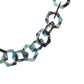Close-up detail of the SUPERNATURAL Chain in Galaxy by Fallenbrokenstreet, showcasing multi-toned acetate links in green, blue, and black. The chain features large interlocking links, each approximately 35mm wide, with a high-gloss finish. Perfect for securing sunglasses while elevating your outfit. Ideal for festivals, streetwear, and daily wear.

