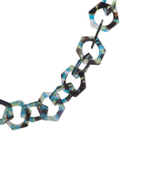 Close-up detail of the SUPERNATURAL Chain in Galaxy by Fallenbrokenstreet, showcasing multi-toned acetate links in green, blue, and black. The chain features large interlocking links, each approximately 35mm wide, with a high-gloss finish. Perfect for securing sunglasses while elevating your outfit. Ideal for festivals, streetwear, and daily wear.

