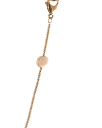 Close-up of the Button Chain in 24k gold by FallenBROKENstreet. This elegant eyewear chain features a signature embossed button detail and lobster clip closures. Ideal for styling with FallenBROKENstreet sunglasses or your favourite frames.

