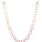 Full length view of the clear pink SUPERNATURAL Chain, showing off its lightweight, flexible acetate links and gold hoop connectors. Ideal for styling with any sunglasses or glasses.

