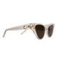 The Astral Plane sunglasses in Skywalker/Amber shown at a side angle, highlighting sculptural acetate lines, amber polarised lenses, and elegant gold embellishments at the temples. Clean product shot.

