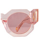 Side-close crop of THE COSMOS – Pink/Pink sunglasses showcasing the soft blush pink tint of lenses and sculpted acetate front frame.

