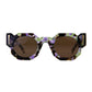 Close-up front view of The Cosmos – Moondust/Amber sunglasses by Fallenbrokenstreet. Features a cosmic acetate frame with soft galactic tones and amber CAT3 lenses. Highlighting the unique octagonal shape and polished gold details on temples. Clean white background for Shopify listing.

