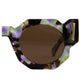 Angled image of The Cosmos sunglasses featuring a moondust acetate frame and amber lenses. Highlights the layered design and sturdy shape of the sunglasses.