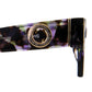 Close-up of sunglasses arm featuring 24k gold-finished circle detail and acetate colorway. Great for SEO optimization focusing on sunglasses gold hardware, fashion eyewear, and unique frame design.
