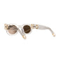 Flat lay from rear angle of The Cosmos sunglasses in Skywalker/Amber. Displays how arms curve behind ears for fit, while showing off structural lines and gold chain ports. Useful for showcasing function and form.
