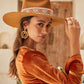 Model wearing FBS x Nine Lives Bazaar wide brim wool felt hat with retro ribbon, styled with burnt orange velvet

