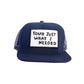 Front view of FBS x Marty Baptist Needed Cap in navy with embroidered statement patch

