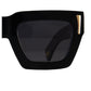 Close-up of black polarised lenses with 24k gold detailing and front chain attachment point. A clean, sculptural shot of The Mischief’s sharp angles and elevated frame finish.

