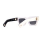 Close-up of black polarised lenses with 24k gold detailing and front chain attachment point. A clean, sculptural shot of The Mischief’s sharp angles and elevated frame finish.

