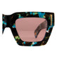 Close-up side angle of The Mischief sunglasses showing the pink lenses and galaxy-patterned acetate. Highlights the clean sculptural form and lens tint.

