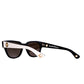 Side profile of NYX White on Black sunglasses with chain-ready gold accent arms


