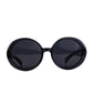THE ORBIT – Stardust round black sparkly sunglasses by FallenBROKENstreet, front view