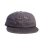 Front-facing view of Dope Lemon dad cap with “Rose Pink Cadillac” embroidered text.

