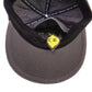 Inside view of Dope Lemon dad cap showing stitched panels and lemon label next to secret pocket.


