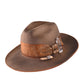 A brown wide-brimmed hat with a vintage patina, featuring a combination of sandalwood and quartz crystal details, an adjustable inner band, and a grosgrain ribbon outer band.