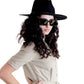 Model wearing the Edison Rancher hat in black with sunglasses and a light shirt, showcasing the hat’s structured crown and bold silhouette in a modern, minimalist styling.

