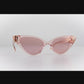 Product video showing a rotating view of the sunglasses to reveal full form and pink lenses

