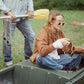 The Cosmos – Skywalker/Amber sunglasses while sitting in a tinny boat. Vintage vibe, relaxed styling, and great engagement value for brand content.